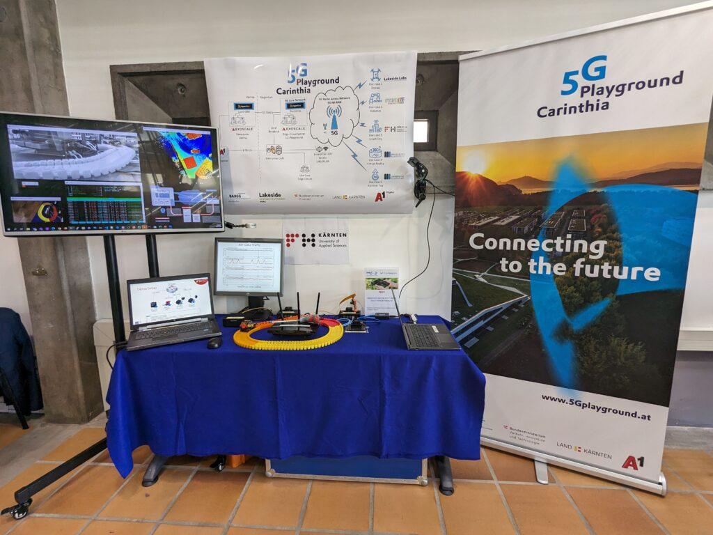 A picture of the demo setup at the ETSI IoT Conference 2023, consisting of a simulated Smart City, with multiple cameras.